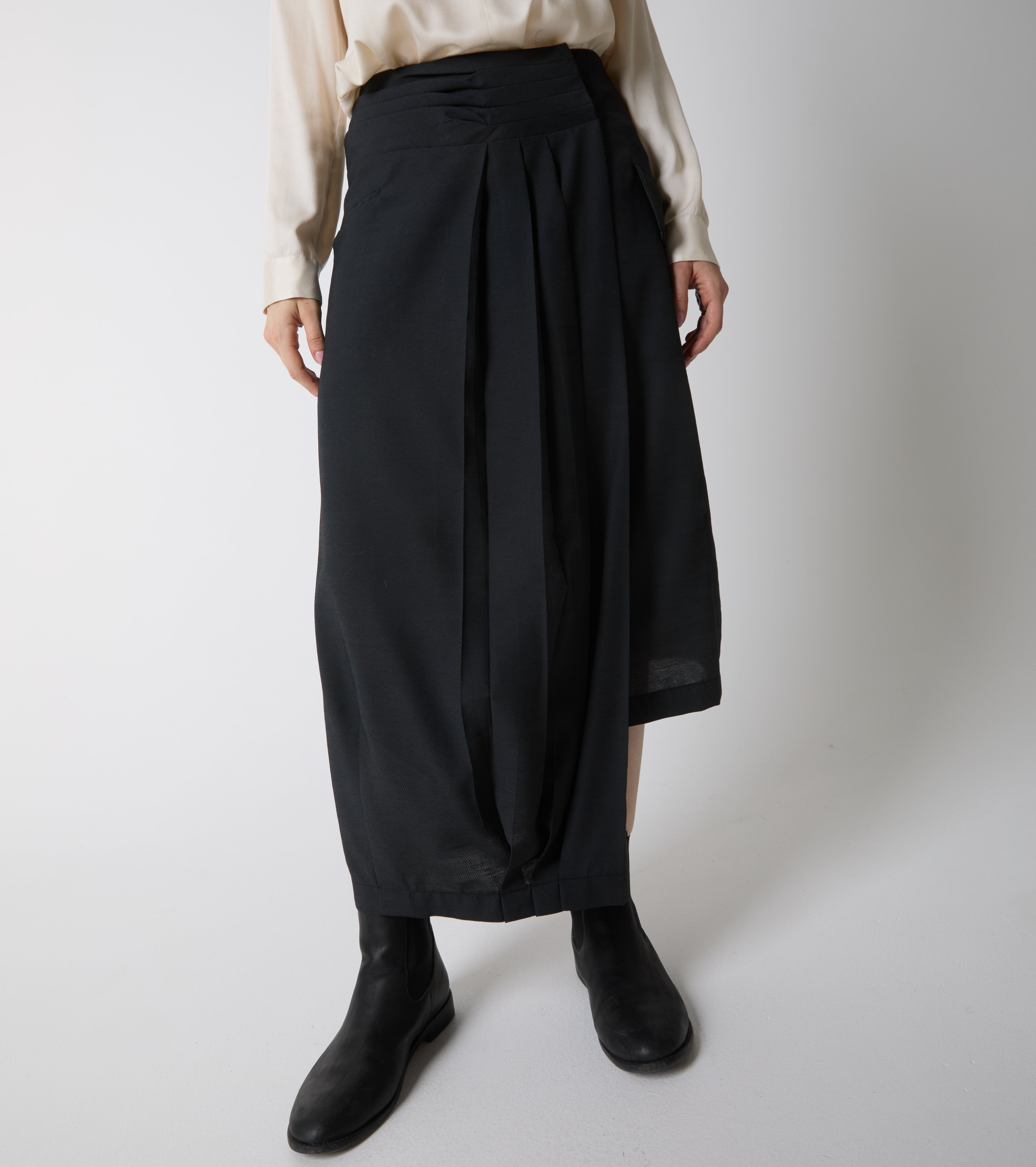 Long asymmetrical skirt with pleats