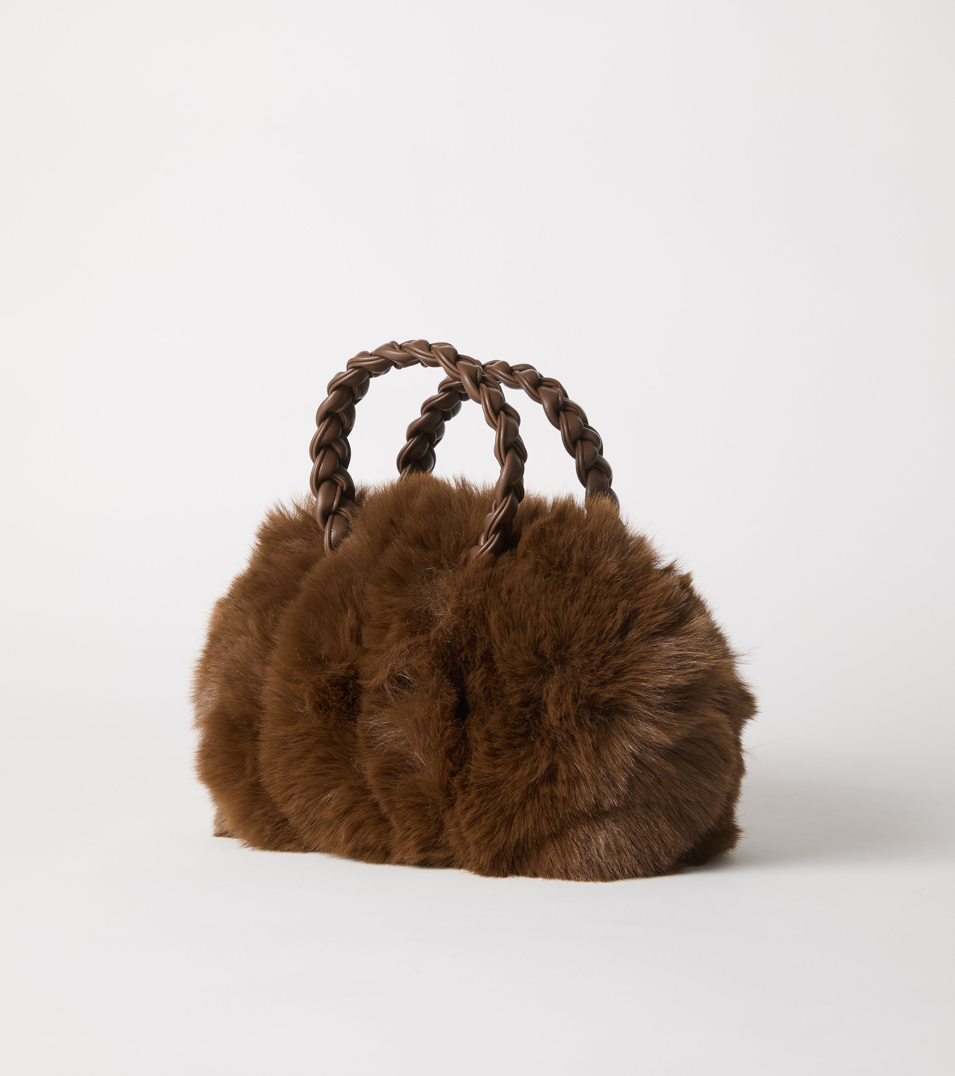 Borsa in ecopelliccia con manici intrecciati