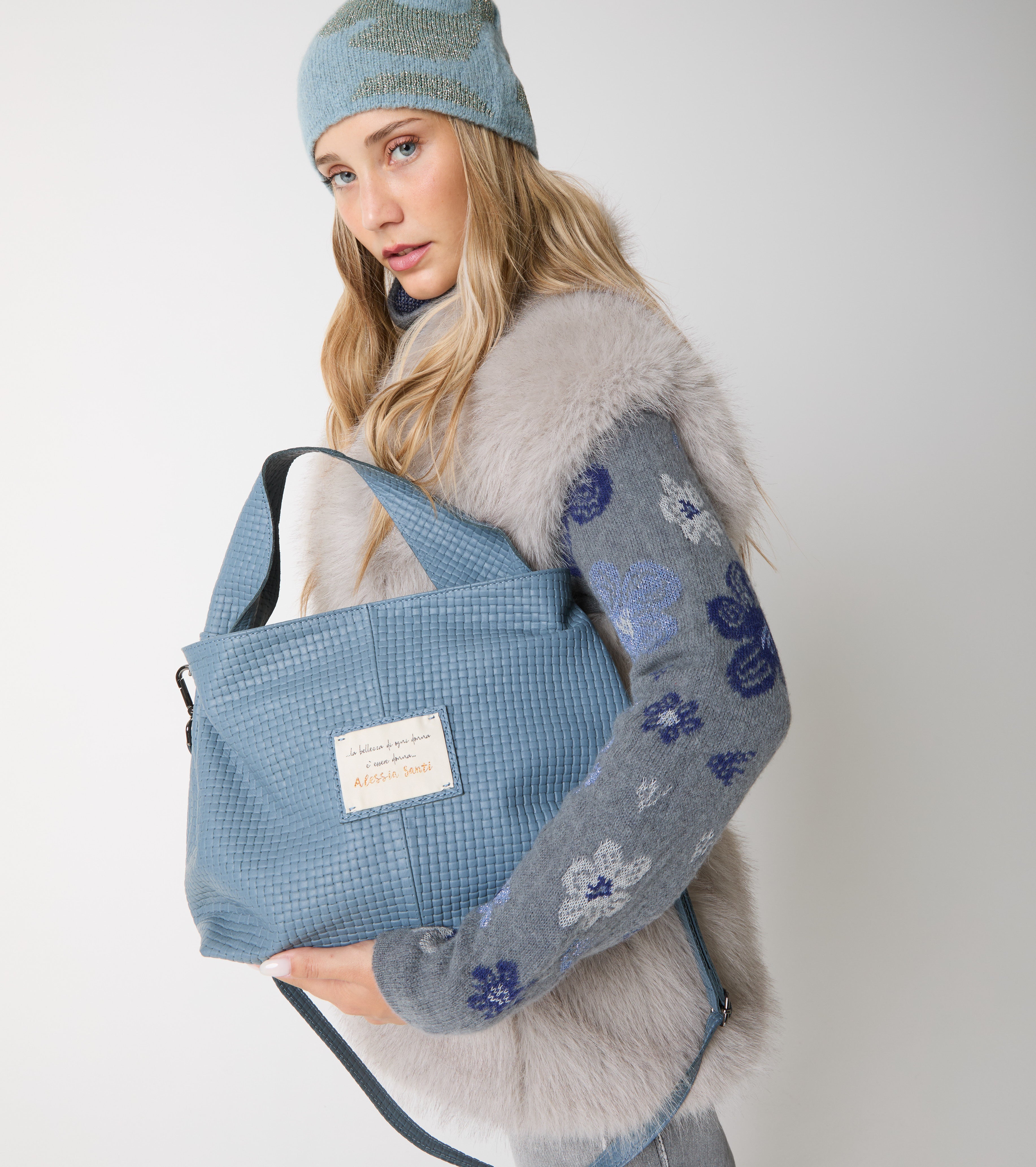 Leather handbag with patch