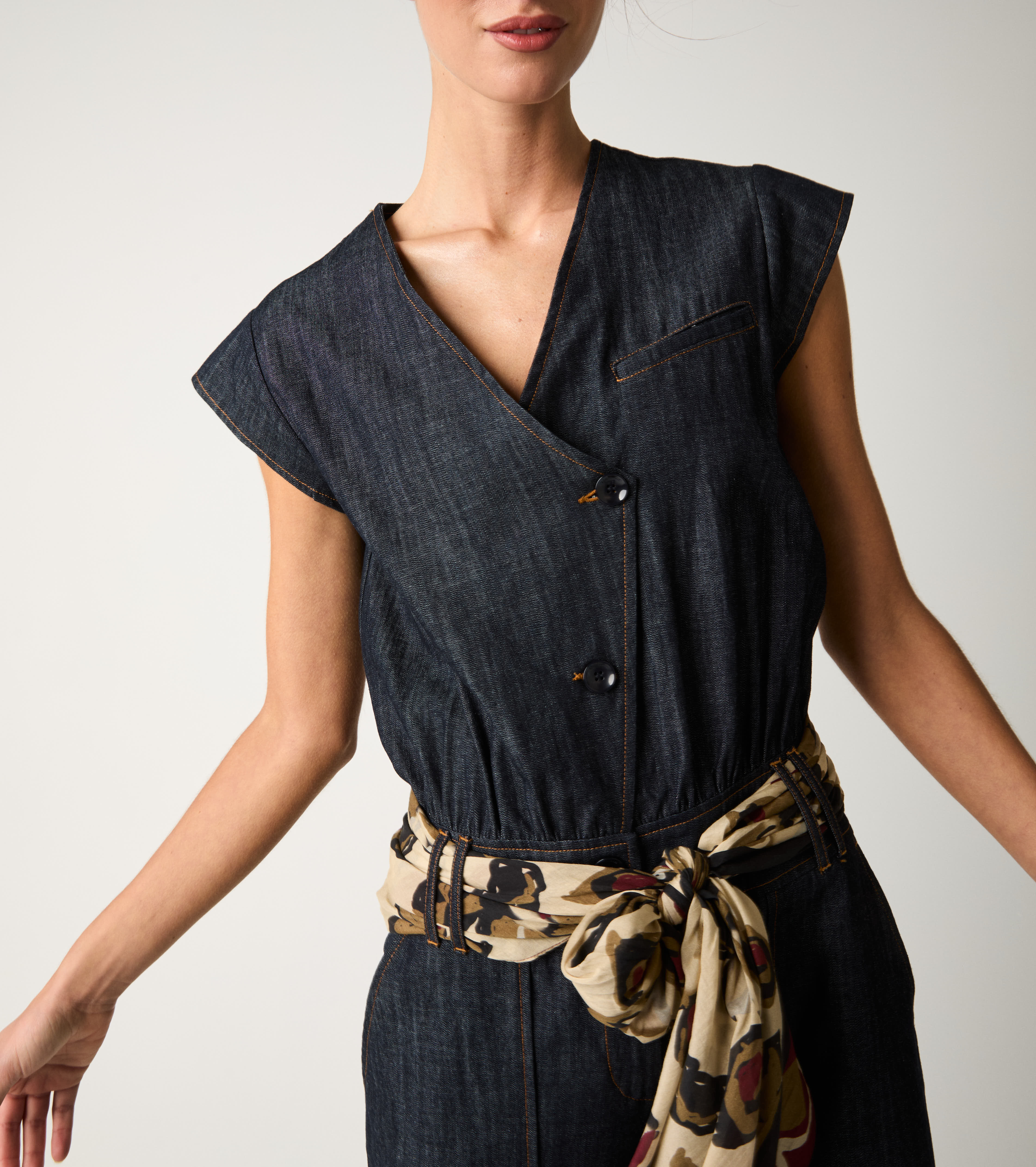 Women's denim jumpsuit with single buttons