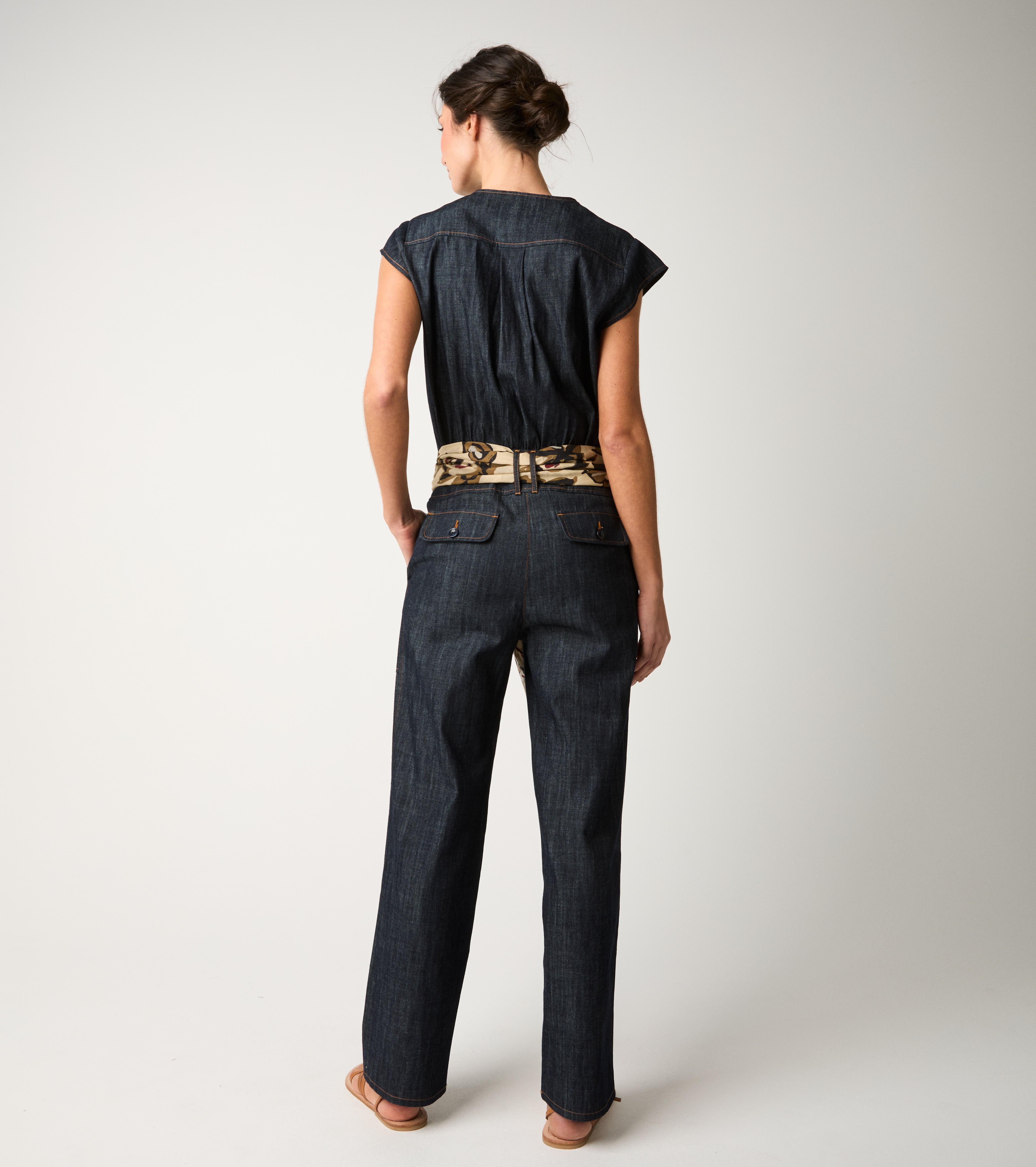 Women's denim jumpsuit with single buttons