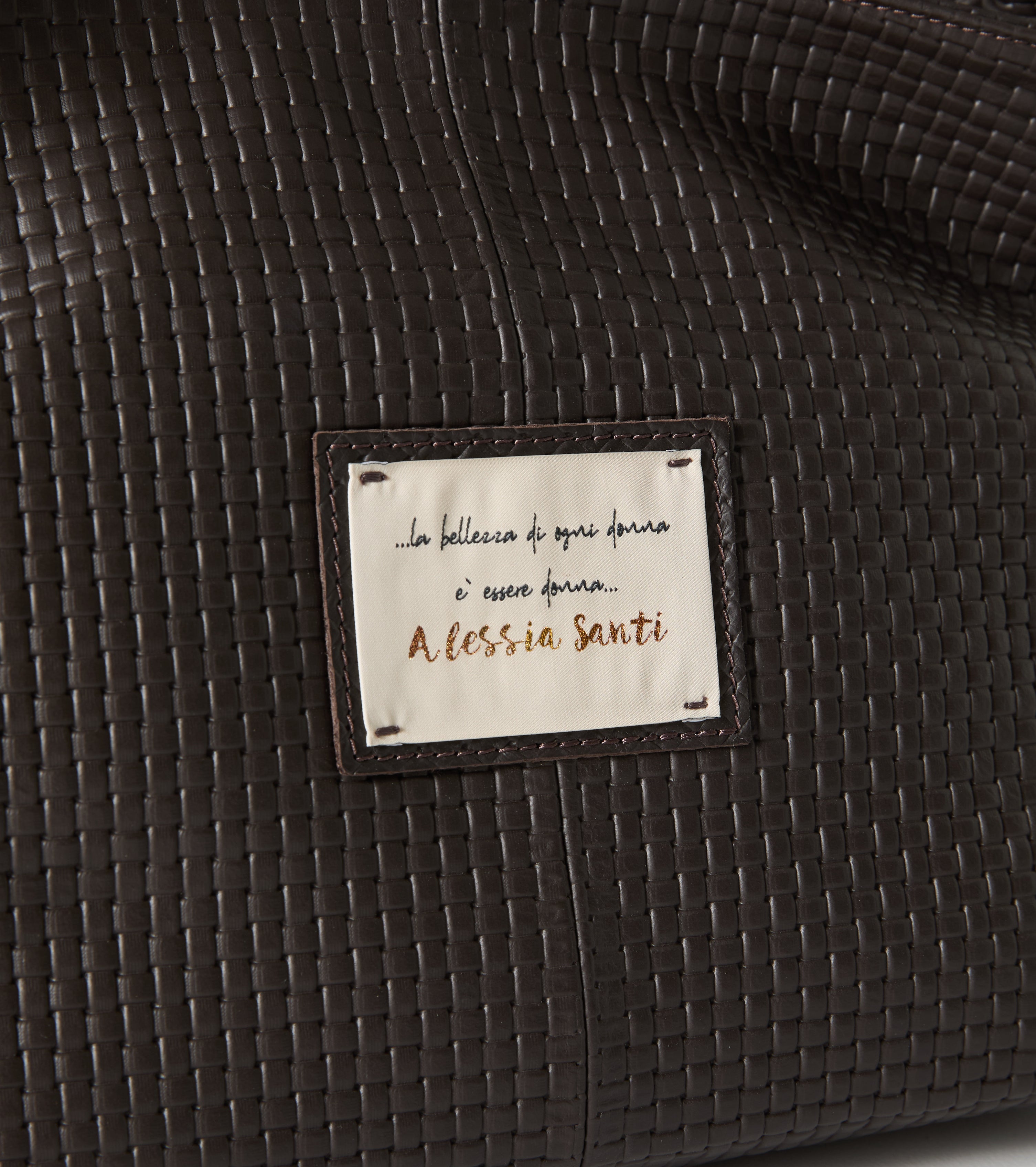 Leather handbag with patch